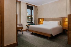 Postel nebo postele na pokoji v ubytování Hilton Milan + 37 fotografií