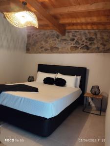 a bedroom with a bed with two cats on it at Tapada das Carvalhas in Castelo Branco +148 photos