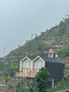 a house on the side of a hill at Tribuana villa Dieng in Kejajar