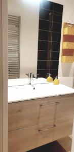 a bathroom with a sink and a mirror at maison ville st aff in Saint-Affrique +7 photos