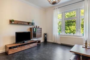 TV a/nebo společenská místnost v ubytování Stadtvilla