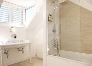 a bathroom with a sink and a shower at Harbour Hotel & Spa St Ives in St Ives