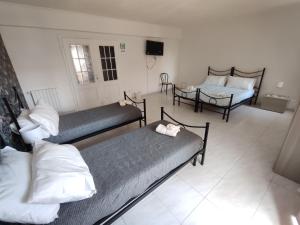 Postel nebo postele na pokoji v ubytování Guest house Sinisi