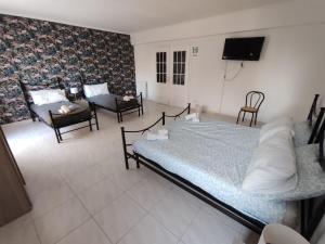 Postel nebo postele na pokoji v ubytování Guest house Sinisi