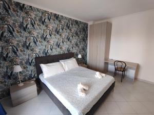 Postel nebo postele na pokoji v ubytování Guest house Sinisi