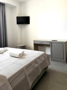 Postel nebo postele na pokoji v ubytování Hotel Marechiaro - Direttamente sul mare