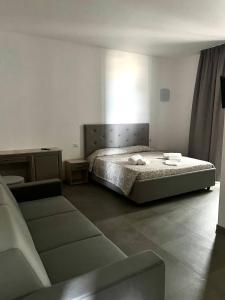 Postel nebo postele na pokoji v ubytování Hotel Marechiaro - Direttamente sul mare