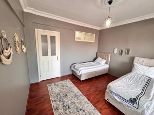 Postel nebo postele na pokoji v ubytování Dilaver-Apart