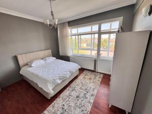 Postel nebo postele na pokoji v ubytování Dilaver-Apart