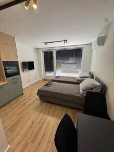 Katil atau katil-katil dalam bilik di ApartHotel Rynek Kielce