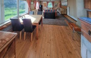 a dining room with a wooden table and chairs at Gorgeous Home In Vinslöv With Wifi in Vinslöv