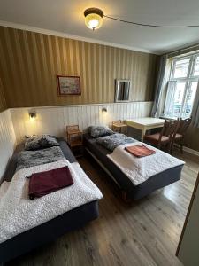Postel nebo postele na pokoji v ubytování Oasen + 37 fotografií