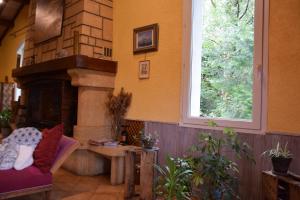 Posezení v ubytování Chambres d'Hôtes L'Orée des Bois