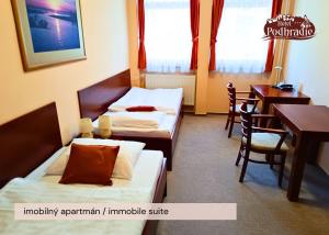 Postel nebo postele na pokoji v ubytování Hotel Podhradie