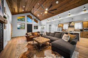 a living room with a couch and a table at Lake-View Gem w/ Outdoor Entertainment in Show Low in Show Low