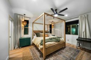 a bedroom with a canopy bed and a ceiling fan at Lake-View Gem w/ Outdoor Entertainment in Show Low in Show Low