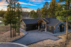 an aerial view of a house with a garage at Lake-View Gem w/ Outdoor Entertainment in Show Low in Show Low