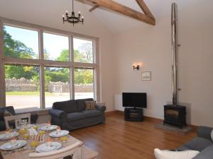 a living room with a couch and a table at 3 Bed in Cheddar 58129 in Burrington