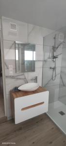 a bathroom with a sink and a mirror at Coup de coeur in Valence