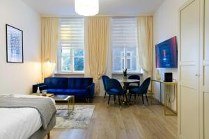 a bedroom with a bed and a table and chairs at Splendid Studio - Close to Center & Danube in Vienna