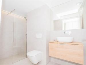 a bathroom with a toilet and a sink and a shower at YBH Atlantic Boutique in Vigo +111 photos