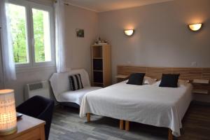 Postel nebo postele na pokoji v ubytování Chambres d'Hôtes L'Orée des Bois