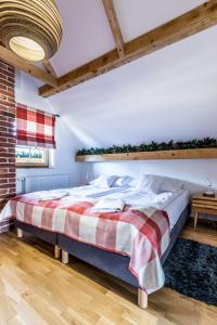 Łóżko lub łóżka w pokoju w obiekcie Tylkowa CHata