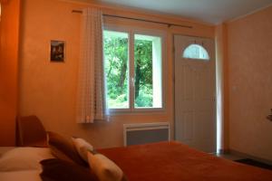 Postel nebo postele na pokoji v ubytování Chambres d'Hôtes L'Orée des Bois