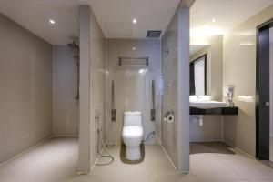 a bathroom with a toilet and a sink at Centrestage PJ by Master House in Petaling Jaya