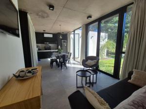 a living room with a couch and a table with chairs at El Cairel 2 in Paso de la Patria