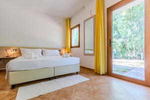 Ένα ή περισσότερα κρεβάτια σε δωμάτιο στο Iglesias Countryside, Nature & Pool +23 φωτογραφίες