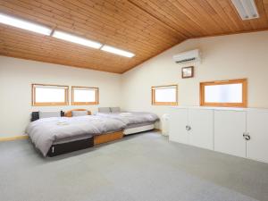 Postel nebo postele na pokoji v ubytování Urayasu Horie House -浦安堀江ハウス- Disneylandまで約30分 Wi-Fi 駐車場付で1棟貸切