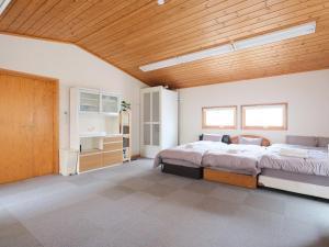 Postel nebo postele na pokoji v ubytování Urayasu Horie House -浦安堀江ハウス- Disneylandまで約30分 Wi-Fi 駐車場付で1棟貸切