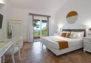 Posteľ alebo postele v izbe v ubytovaní Hotel Cala Caterina
