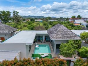 an aerial view of a house with a swimming pool at Bang tao modern holiday style pool view high speed WiFi in Laguna Phuket