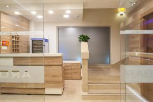 a lobby of a store with a potted plant at Guesthouse Aroma in Makarska