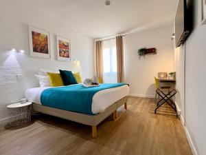 Postel nebo postele na pokoji v ubytování Hotel L'Escapade