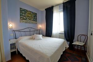 Ένα ή περισσότερα κρεβάτια σε δωμάτιο στο Uno Sguardo Sul Mare