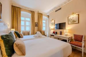 Кровать или кровати в номере Casa Romana Hotel Boutique