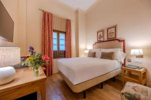 Кровать или кровати в номере Casa Romana Hotel Boutique