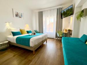 Postel nebo postele na pokoji v ubytování Hotel L'Escapade