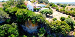 an aerial view of a house and trees at Monte da Casa Telhada in Santiago do Cacém