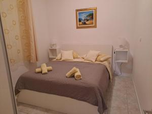 Postel nebo postele na pokoji v ubytování Apartments Mig