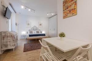 A television and/or entertainment centre at San Salvario Apartments by Wonderful Italy