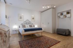 A bed or beds in a room at San Salvario Apartments by Wonderful Italy