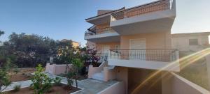 a building with balconies on the side of it at Harmony 3 in Artemida