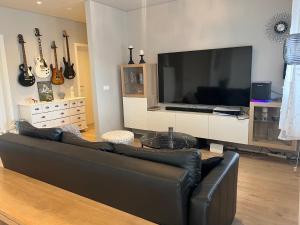TV a/nebo společenská místnost v ubytování Hagalækur
