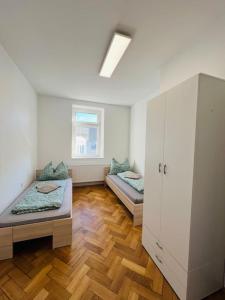 Postel nebo postele na pokoji v ubytování Leoben Top 6