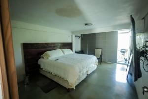 Postel nebo postele na pokoji v ubytování Downtown Hostel Chetumal