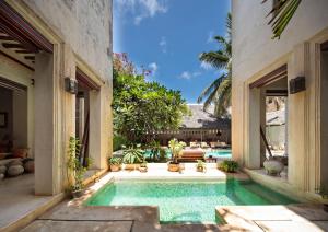 a swimming pool in the middle of a house at LAMU HOUSE in Lamu